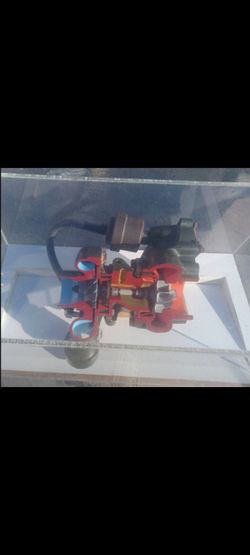 Turborcharger Cutaway In A Plastic Display Case