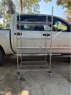 Metal shelf with wheels