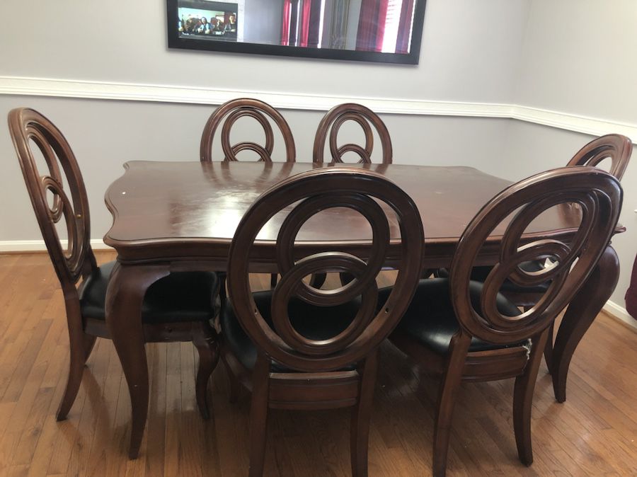 Wood and black leather dining table and 6 chairs