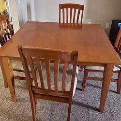 Wooden Table With Four Matching Chairs 