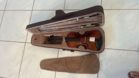 Violin with case  straps to carry looks new