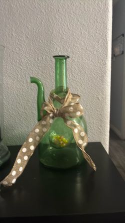 “Green decorative glass vase in great condition — $40 OBO.”