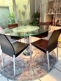 Round glass dining table with 4 chairs