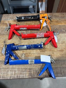 Caulk guns