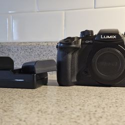 Panasonic Lumix GH5 Camera like new.  Shutter under 11,000.  Comes With 2 Batteries And Charger