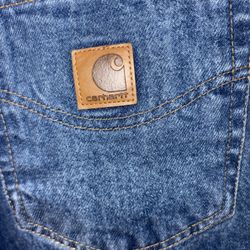 Carhartt men's relaxed fit tapered leg jeans in a blue denim wash