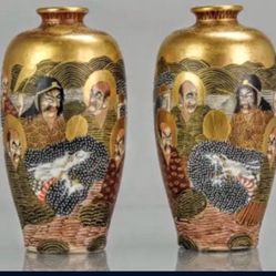  pair of Japanese Satsuma mirror vases features intricate designs of Immortals in the 1000 Faces pattern. 