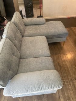 Light blue sectional with chase
