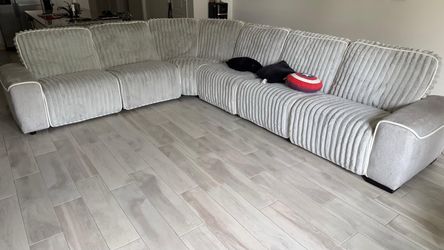 L shaped couch with 4 reclining seats