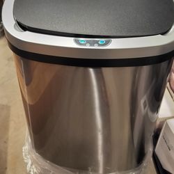 16 gallons automatic stainless steel trash can/ used - good