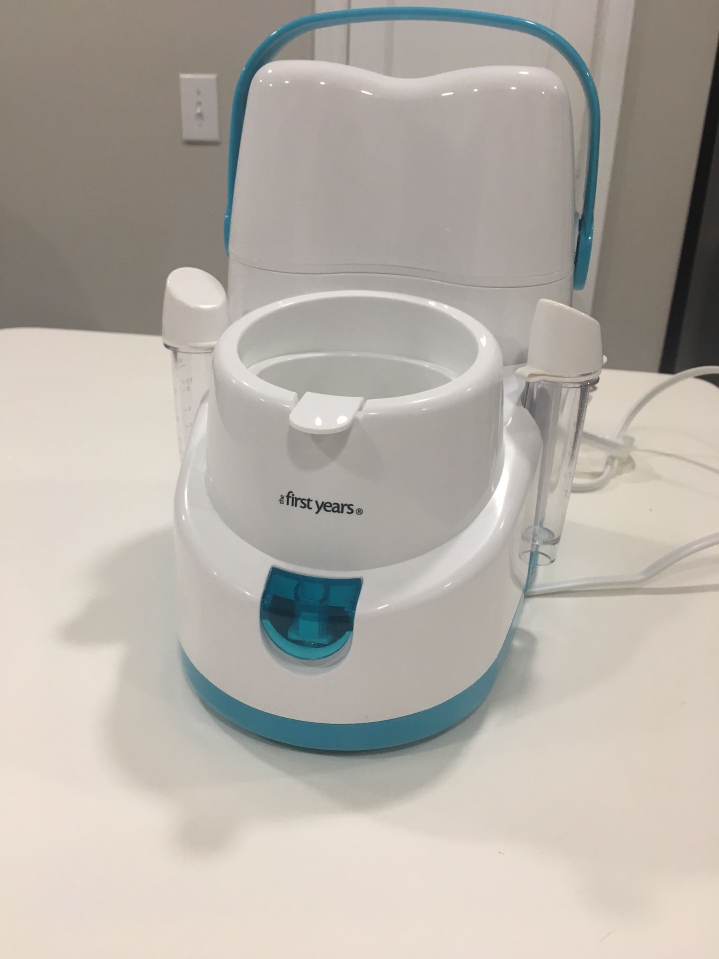 Nursery bottle warmer with cooler