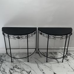 Two black metal side tables