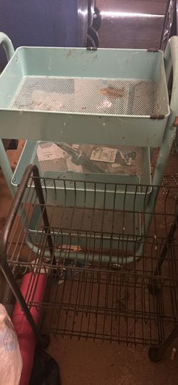 2 well used rolling shelf carts