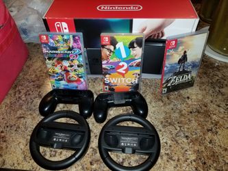 NEW IN BOX NINTENDO SWITCH WITH 3 GAMES AND EXTRA ACCESSORIES