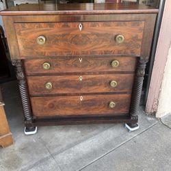 Empire-style mahogany butler's secretary desk with flame veneer.