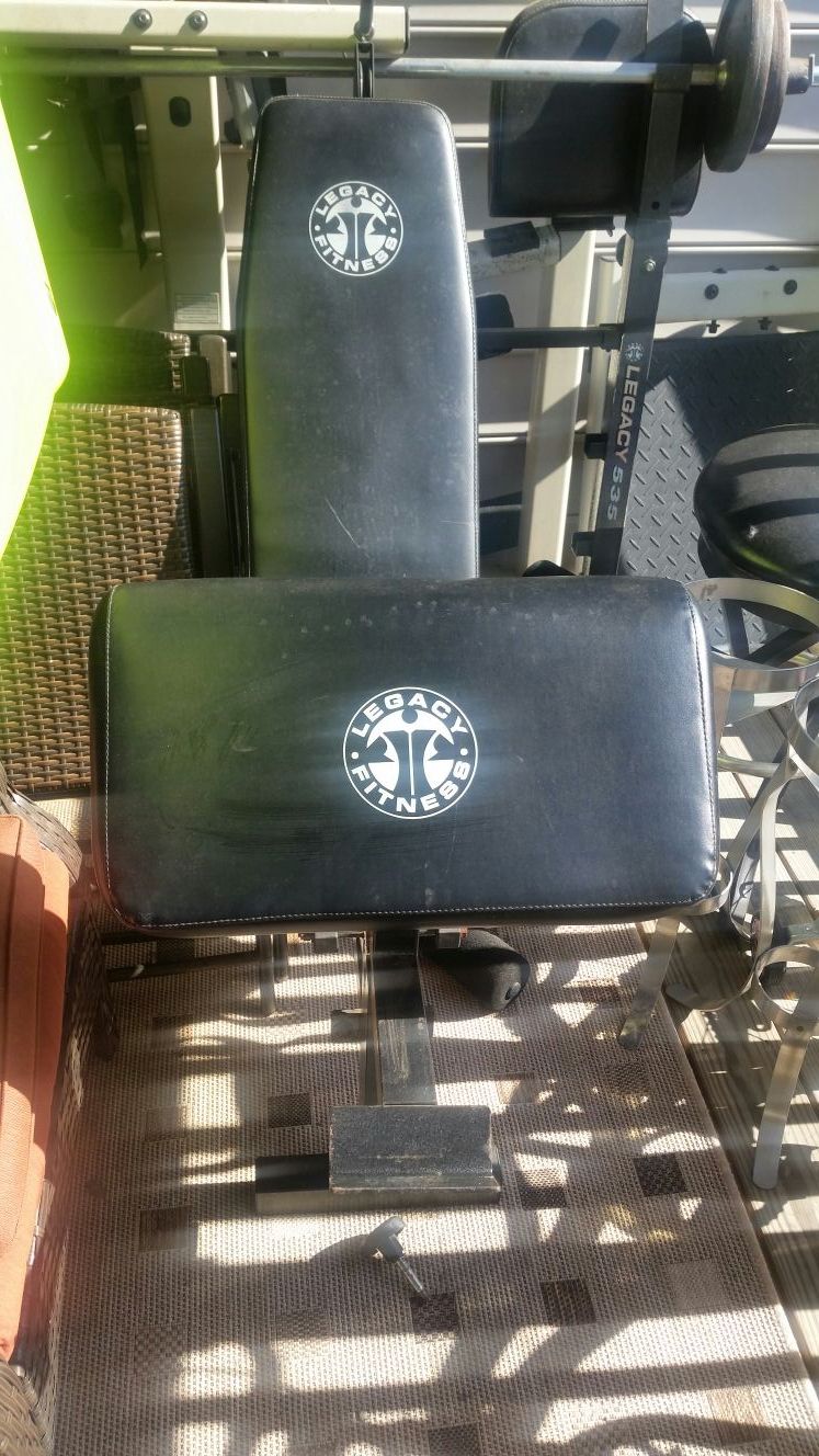 Legacy fitness bench 535 with leg curl and extension attachment, biceps/triceps attachment, no weights or bar included