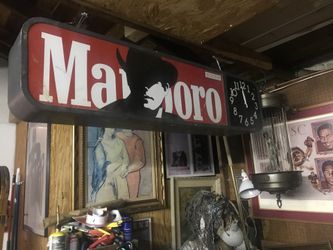 Marlboro double sided sign lights up and a o’clock