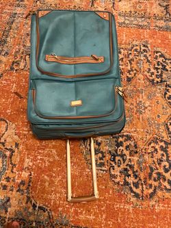 suitcase  with wheels ,used but still in good condition, no ripped ,Send me offer ,