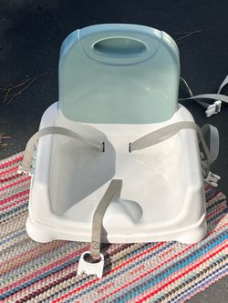 Excellent condition Fisher price booster seat attach to the chair!!!
