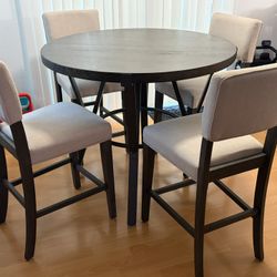 High Top Round Table And Four Chairs