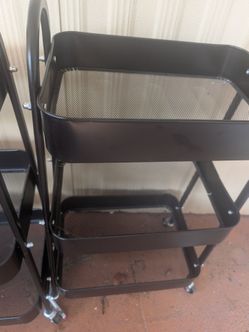 Three tiered carts with wheels. Good for laundry rooms. Extra storage in your garage moving soon. Need them gone $25 for all three