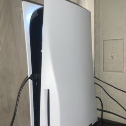 Ps5 With A Controller And Headset