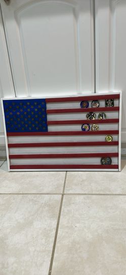 Handcrafted Wooden American Flag Challenge Coins Holder 24” x 15.5” x 1”. It holds 60 to 70 coins depending on sizes. The right side of the frame as m