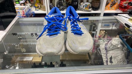 Size 10.5. Mens gray and blue ASICS Gel-Nimbus 21 running shoes