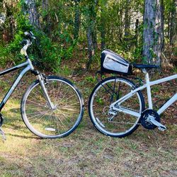 Two Trek Bicycles ( Verve 2 & 7.5 FX ) And A Dovetail Bike Rack