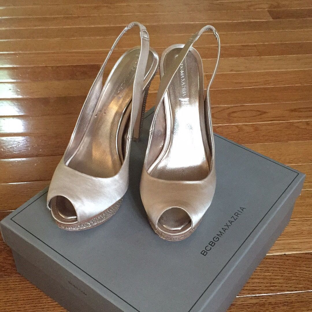 Pair of champagne peep toe shoes, size 8,5