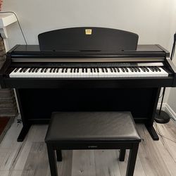 This Yamaha Electronic Piano Clavinova