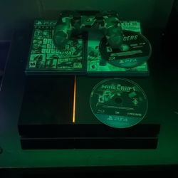 PS4, with 1 controller, minecraft, power cord, GTA 5, and 2 other games.