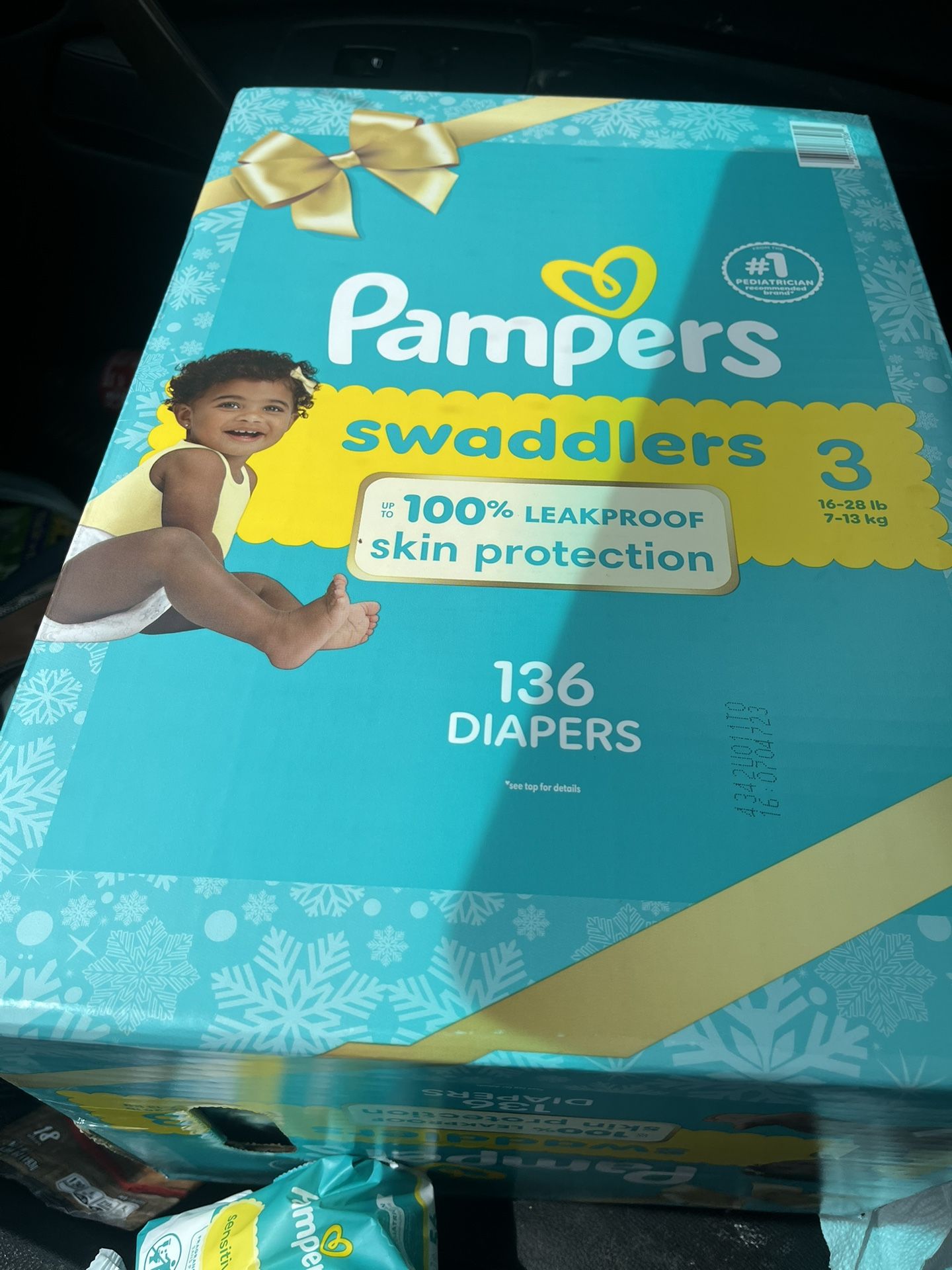 Pampers swaddle 2brand new Boxes One size 3, 136 count comes with two packs of sensitive pampers wipes, 56 in each pack Then A Second Box Of Pampers 4