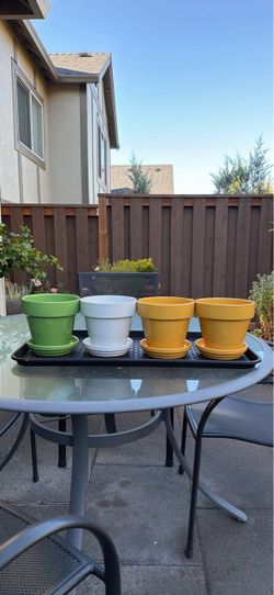 Set of 4 glazed ceramic planters with matching saucers