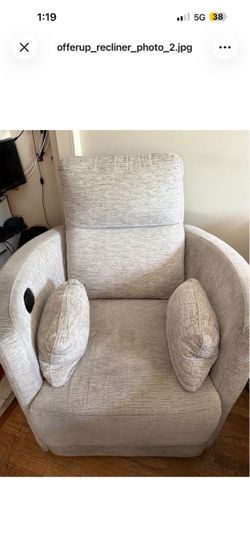 Beautiful Beige Rocking Recliner with Pillows