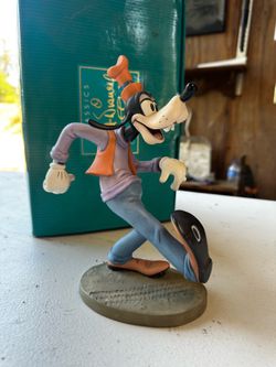 Goofy figurine “Oh the World Owes Me a Living”