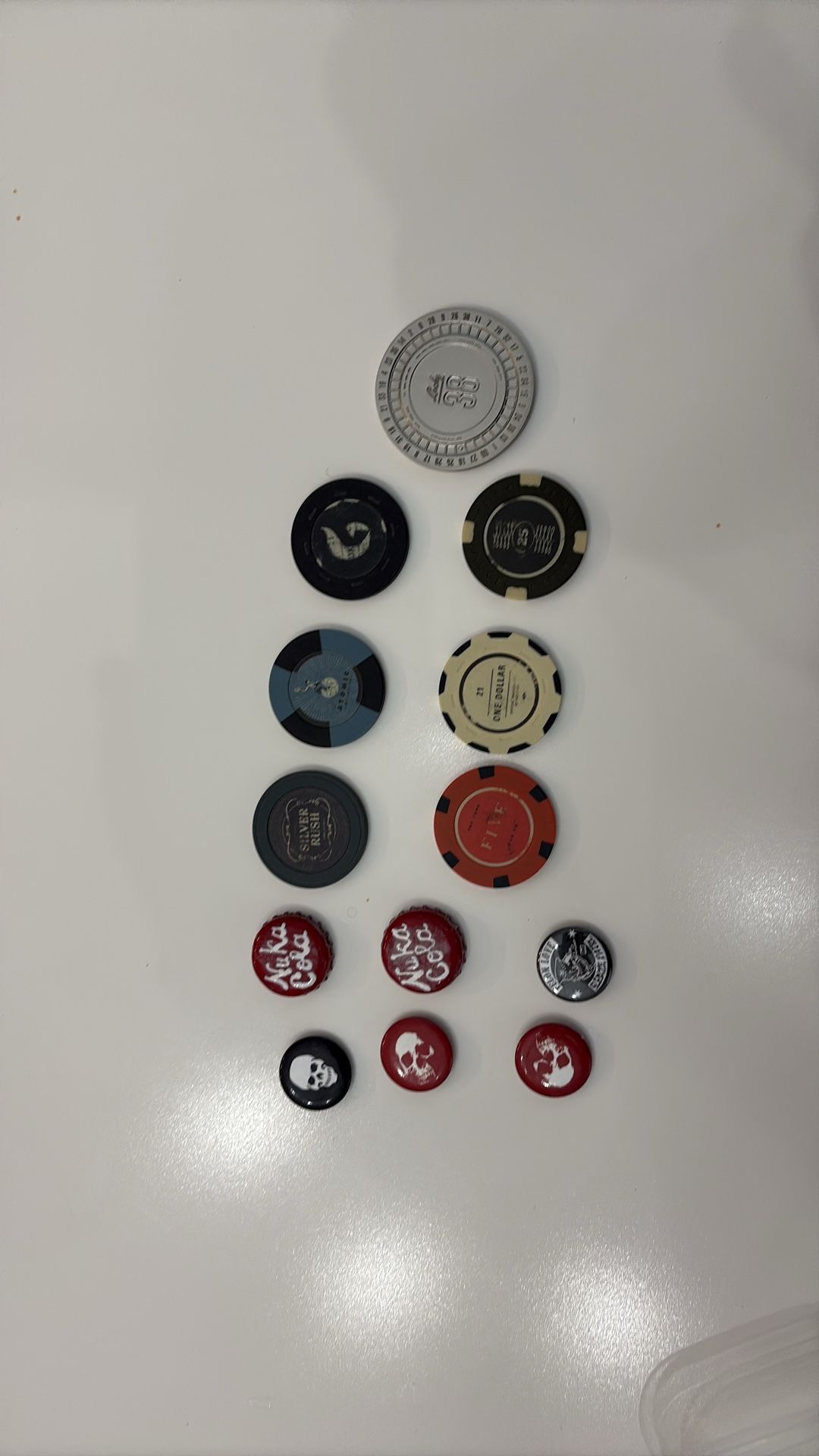 Fallout poker chips, bottle caps and pins