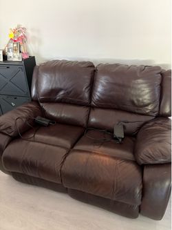 Two Brown leather reclining loveseats