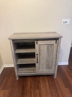 Storage cabinet with sliding door