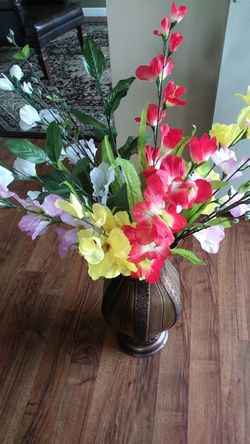 Vase with artificial flowers