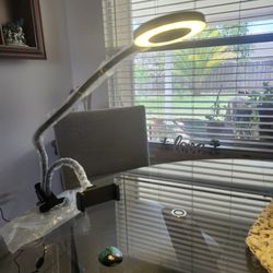 Hands-free lamp with 70 bright LEDs, 5X magnification, used for crafts, videos, photos.