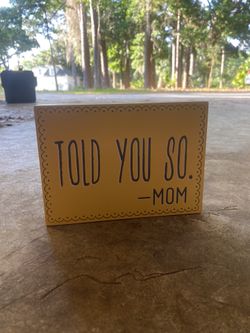 Yellow “told you so- mom” sign