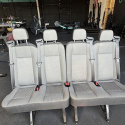 OEM rear bench seats for a Ford Transit passenger van, specifically from the 2015–2026 model years.