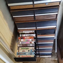 over 180 VHS movies and storage cases