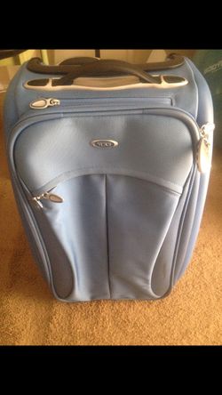 Tumi light blue 22” carry-on