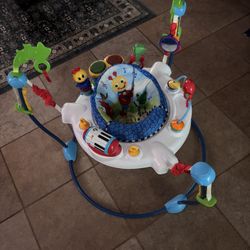 Baby Einstein Neighborhood Symphony Activity Jumper Infant Entertainer with Lights and Melodies, Age 6 months +, Max weight 25 lbs., Unisex  Pick up o