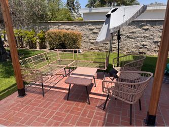 Outdoor sofa and couch with tables and umbrella