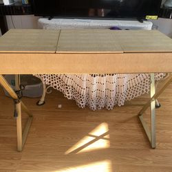 This is a vanity table with a mirror and storage compartments