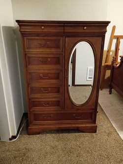 Solid wood chest of drawers. 57"Hx39"Wx18"D. Good condition.
