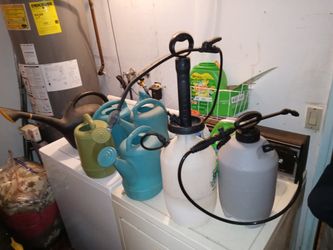 2 Gallon sprayers And Water Jugs